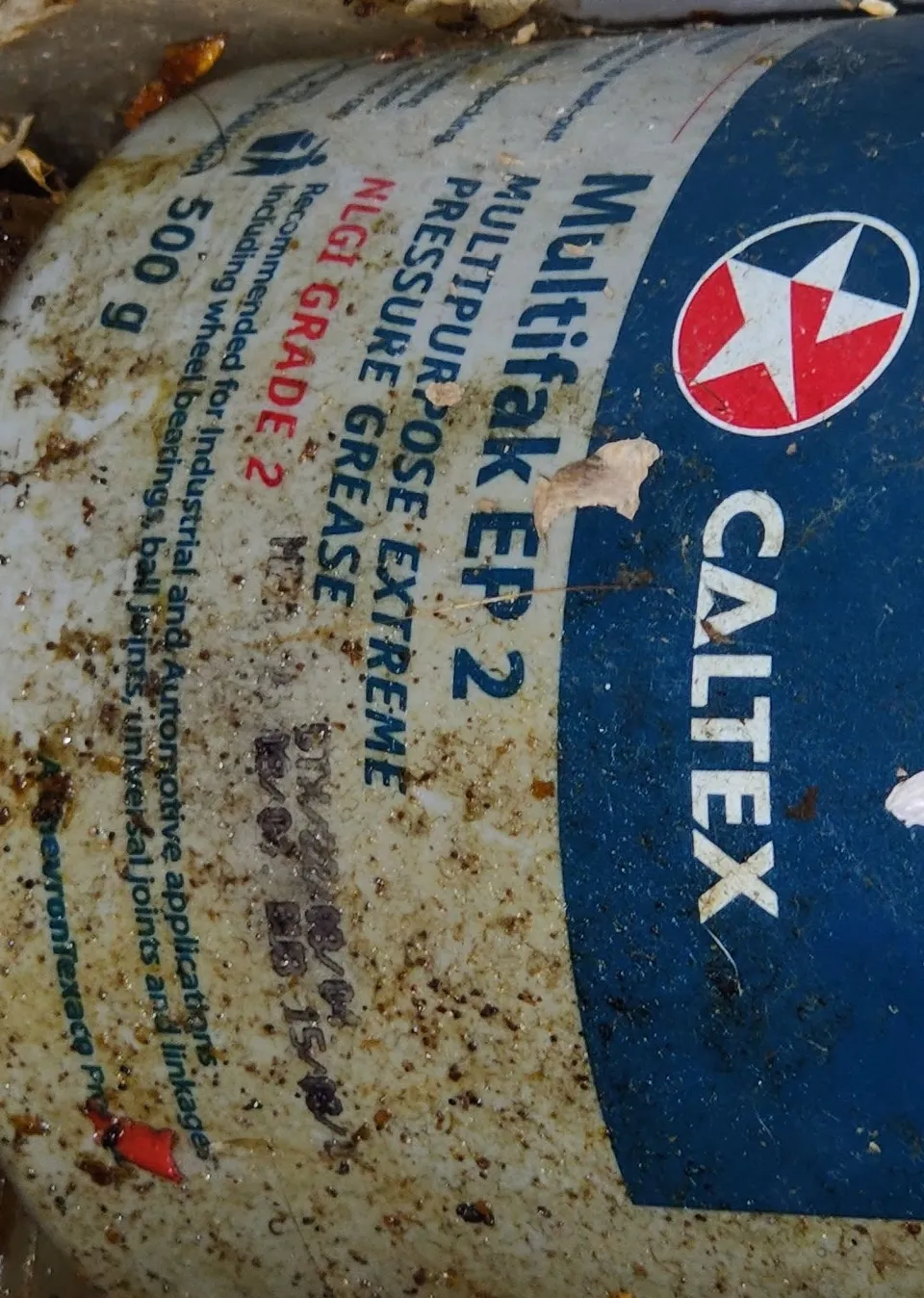 Dirty can of caltex grease