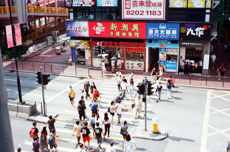 Photo of people crossing the street