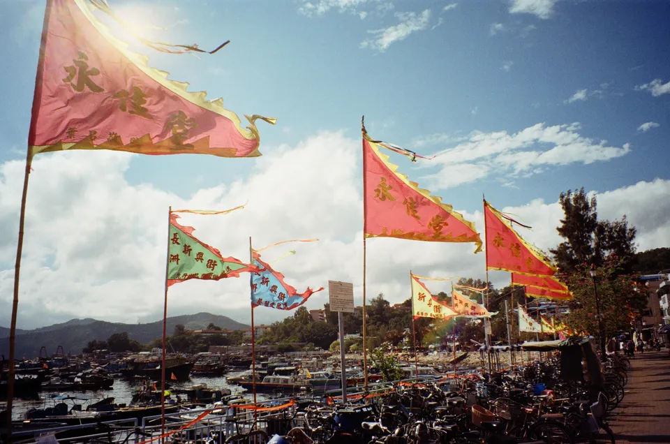 Waving flags right in front of the sun