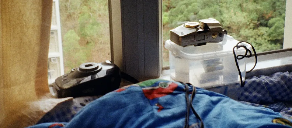 Point-and-shoot cameras by the window