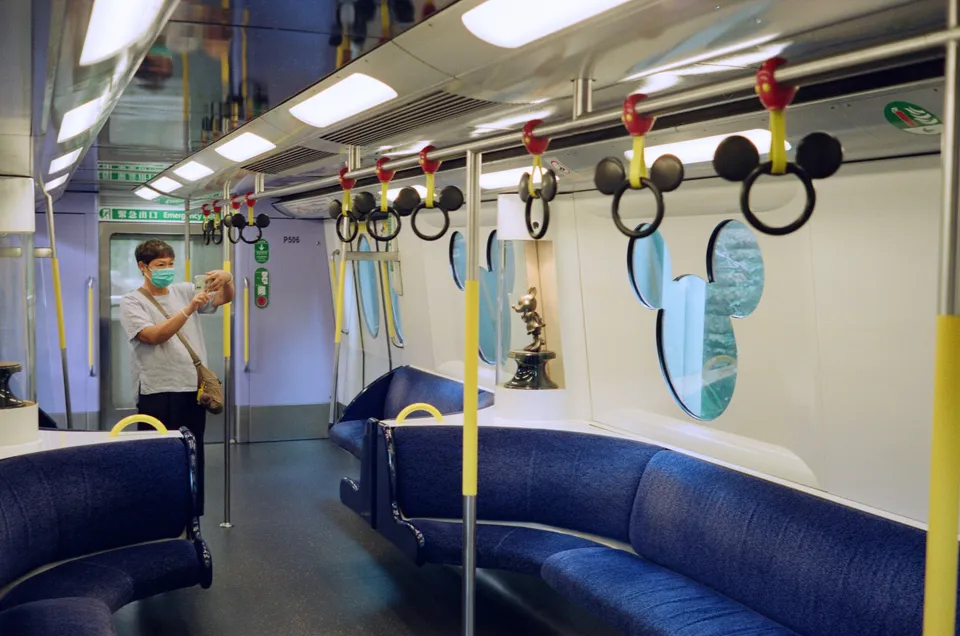 Auntie/uncle taking photo of the special MTR's interior