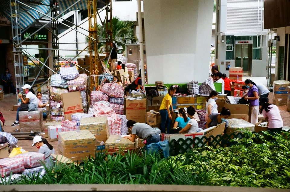 Domestic workers packing up their parcels