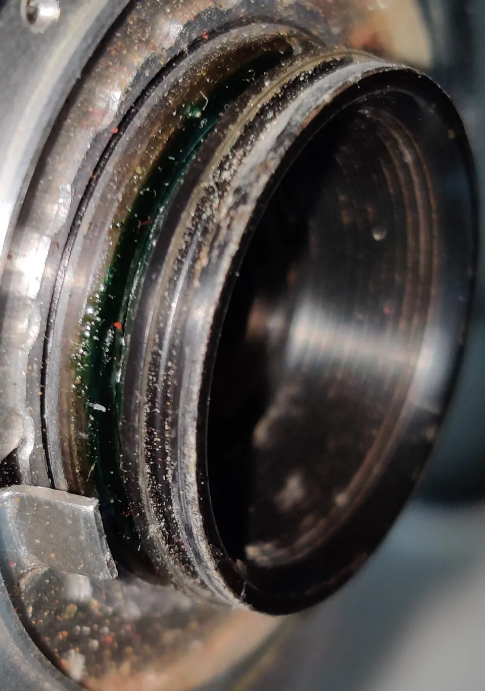 Green grease between front and middle element